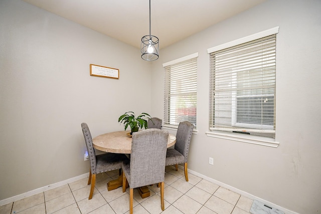 14720 Branchwest Dr, Houston, TX 77082 - dining room featuring baseboards and light tile patterned floors