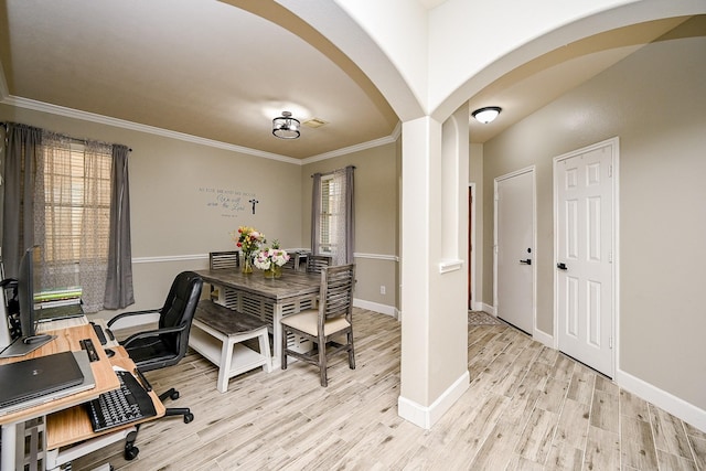 14720 Branchwest Dr, Houston, TX 77082 - home office with arched walkways, light wood finished floors, crown molding, and baseboards