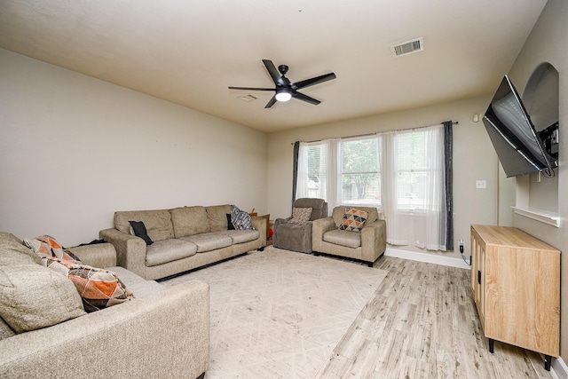 14720 Branchwest Dr, Houston, TX 77082 - living room with light wood-style flooring, a ceiling fan, and baseboards