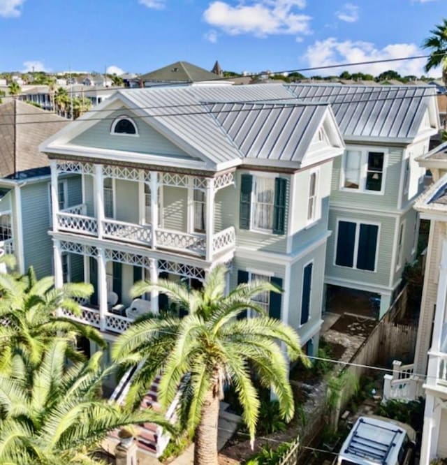 2113 Ball, Galveston, TX 77550 - rear view of house with a standing seam roof, metal roof, and a balcony