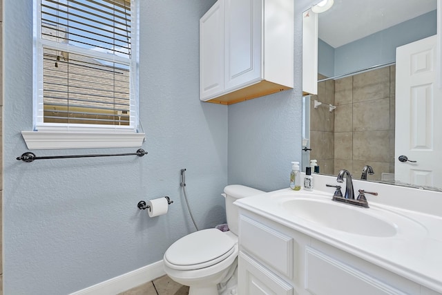 8303 Crescent Knolls Dr, Richmond, TX 77406 - full bath with a textured wall, toilet, baseboards, vanity, and tile patterned flooring