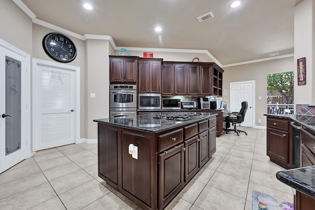 8303 Crescent Knolls Dr, Richmond, TX 77406 - kitchen featuring tasteful backsplash, light tile patterned floors, dark stone countertops, crown molding, and appliances with stainless steel finishes