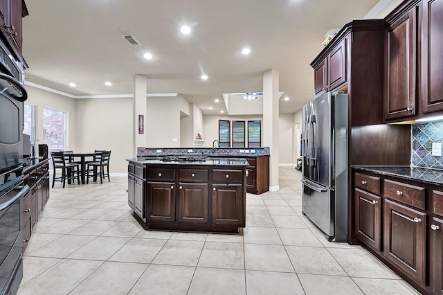 8303 Crescent Knolls Dr, Richmond, TX 77406 - kitchen with appliances with stainless steel finishes, light tile patterned flooring, decorative backsplash, ceiling fan, and recessed lighting