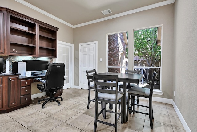 8303 Crescent Knolls Dr, Richmond, TX 77406 - office area with crown molding, light tile patterned floors, baseboards, a textured wall, and built in desk