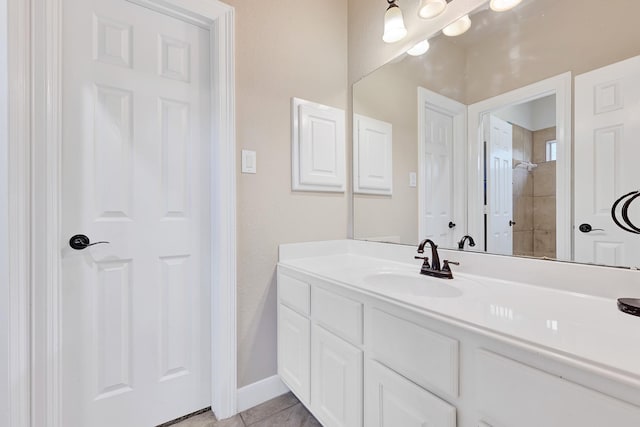 8303 Crescent Knolls Dr, Richmond, TX 77406 - bathroom featuring vanity, tile patterned flooring, and baseboards