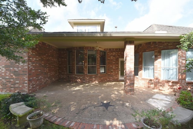 8303 Crescent Knolls Dr, Richmond, TX 77406 - rear view of property with brick siding and a patio area