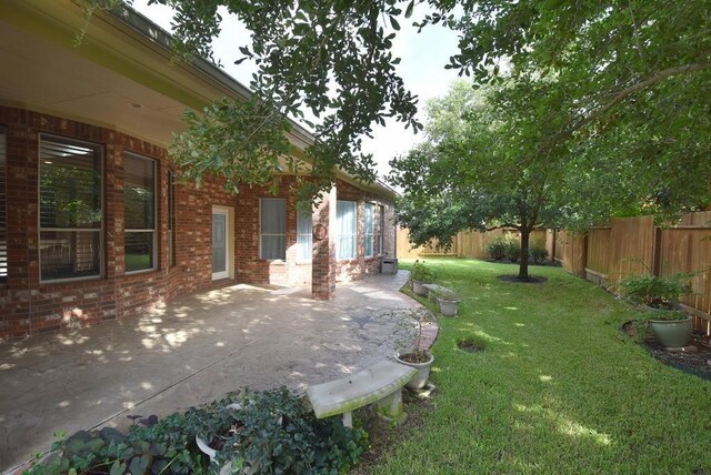 8303 Crescent Knolls Dr, Richmond, TX 77406 - view of yard with a patio area