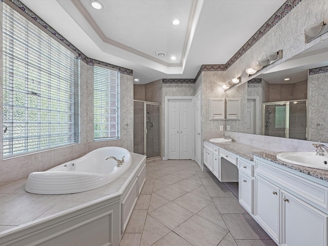 3311 El Dorado Blvd, Missouri City, TX 77459 - full bath with a stall shower, double vanity, a garden tub, tile patterned floors, and a raised ceiling