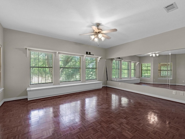 3311 El Dorado Blvd, Missouri City, TX 77459 - empty room featuring a ceiling fan, baseboards, and a textured ceiling