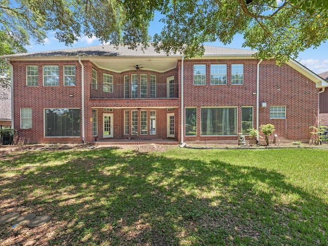 3311 El Dorado Blvd, Missouri City, TX 77459 - rear view of house with a ceiling fan, a yard, brick siding, and a balcony