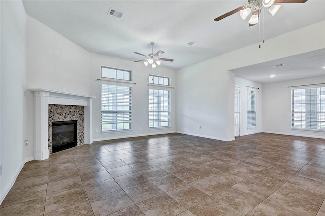 6722 Hawkins St, Manvel, TX 77578 - unfurnished living room with ceiling fan, a high end fireplace, and baseboards