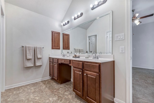 6722 Hawkins St, Manvel, TX 77578 - bathroom with lofted ceiling, double vanity, baseboards, and ceiling fan