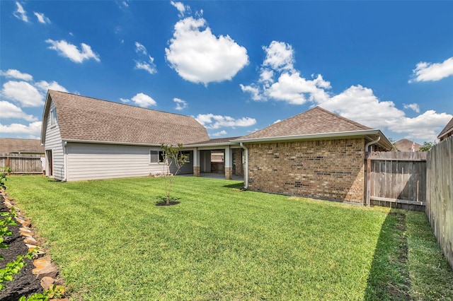 6722 Hawkins St, Manvel, TX 77578 - rear view of property with brick siding and a shingled roof