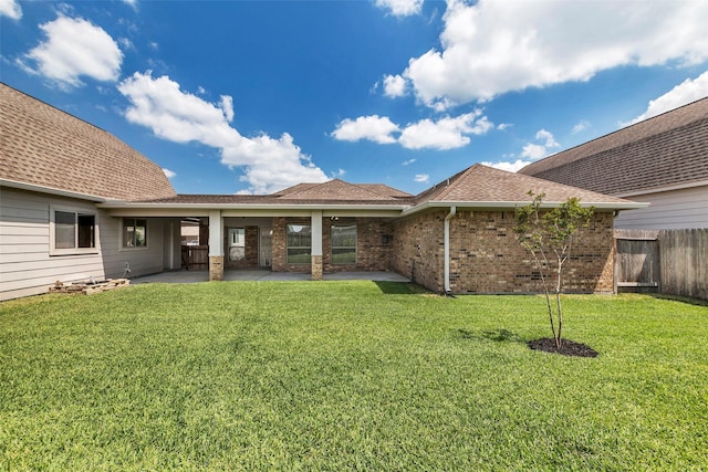 6722 Hawkins St, Manvel, TX 77578 - rear view of property with brick siding, a patio area, and a shingled roof