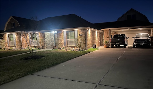 6722 Hawkins St, Manvel, TX 77578 - view of front of home featuring concrete driveway, a yard, a garage, and brick siding