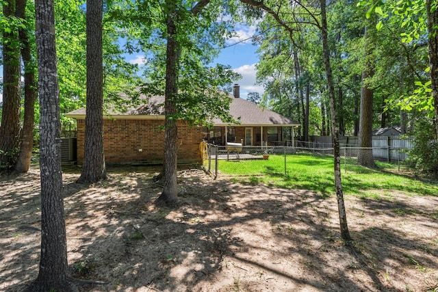 44 Westchester Dr, Conroe, TX 77304 - view of yard featuring fence and central AC unit