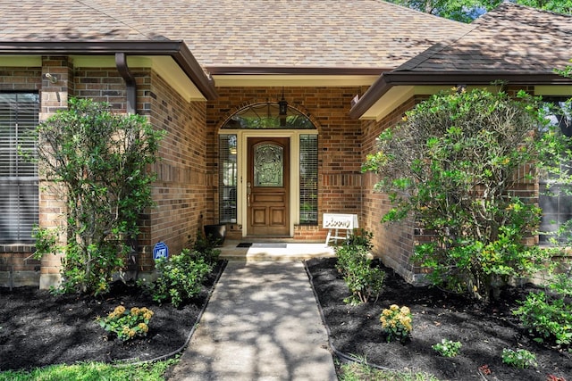 44 Westchester Dr, Conroe, TX 77304 - property entrance with brick siding and roof with shingles