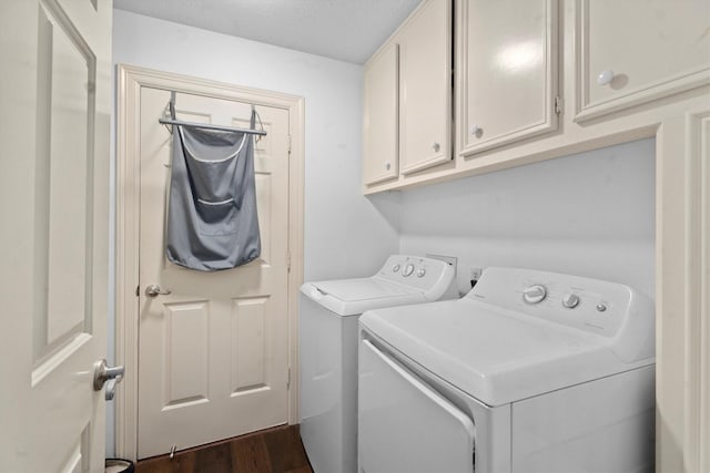44 Westchester Dr, Conroe, TX 77304 - clothes washing area with independent washer and dryer, cabinet space, dark wood finished floors, and a textured ceiling