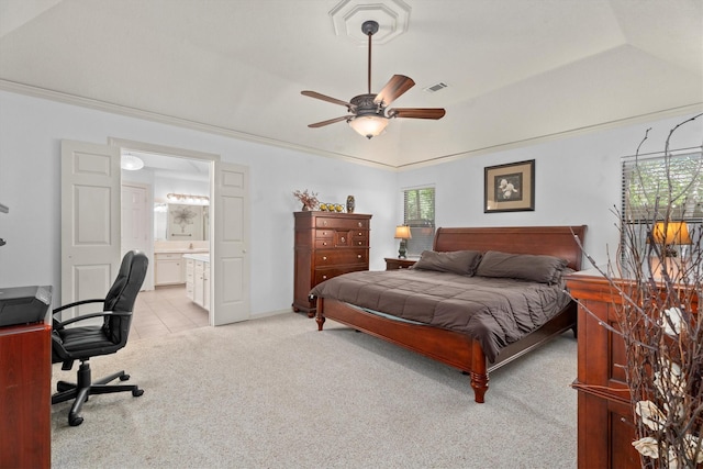 44 Westchester Dr, Conroe, TX 77304 - bedroom with light colored carpet, a desk, ensuite bathroom, ceiling fan, and baseboards
