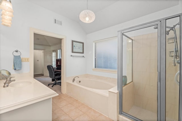 44 Westchester Dr, Conroe, TX 77304 - ensuite bathroom featuring vaulted ceiling, a stall shower, a bath, tile patterned floors, and vanity