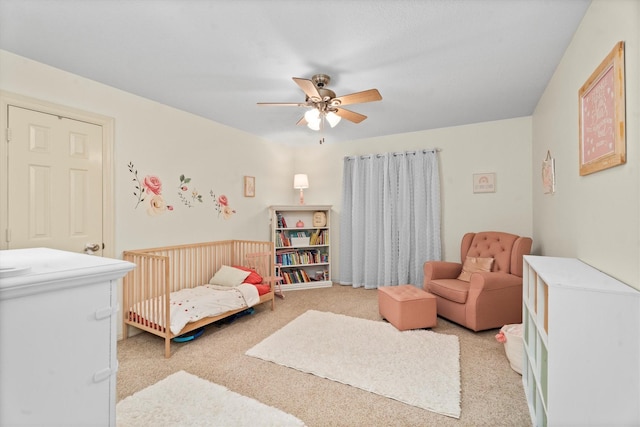 44 Westchester Dr, Conroe, TX 77304 - bedroom with light carpet, a nursery area, and a ceiling fan