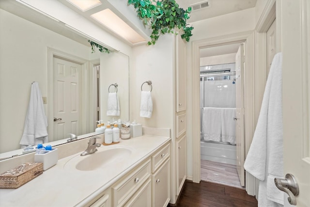 44 Westchester Dr, Conroe, TX 77304 - bathroom featuring an enclosed shower, wood finished floors, and vanity