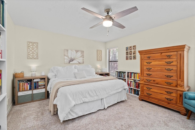 44 Westchester Dr, Conroe, TX 77304 - bedroom with light colored carpet and ceiling fan