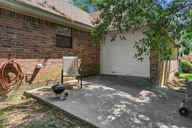 44 Westchester Dr, Conroe, TX 77304 - view of patio featuring a garage and driveway