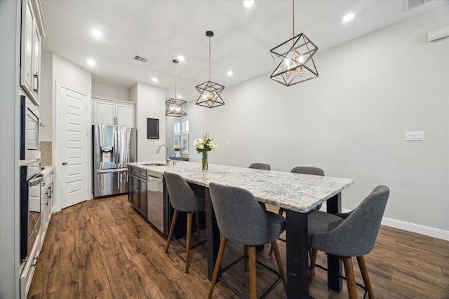 10407 Quiet Courtyard Rd, Houston, TX 77043 - dining area featuring dark wood finished floors, a chandelier, recessed lighting, and baseboards