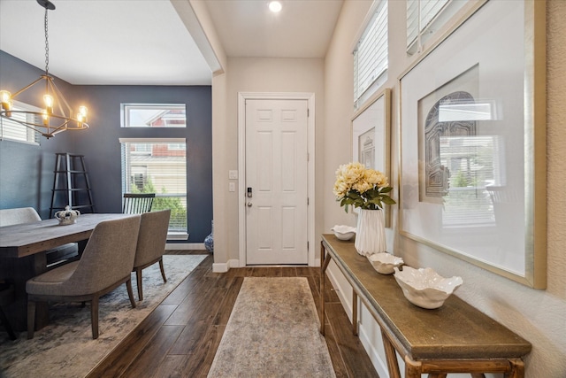10407 Quiet Courtyard Rd, Houston, TX 77043 - entryway with a chandelier, dark wood-type flooring, healthy amount of natural light, baseboards, and recessed lighting