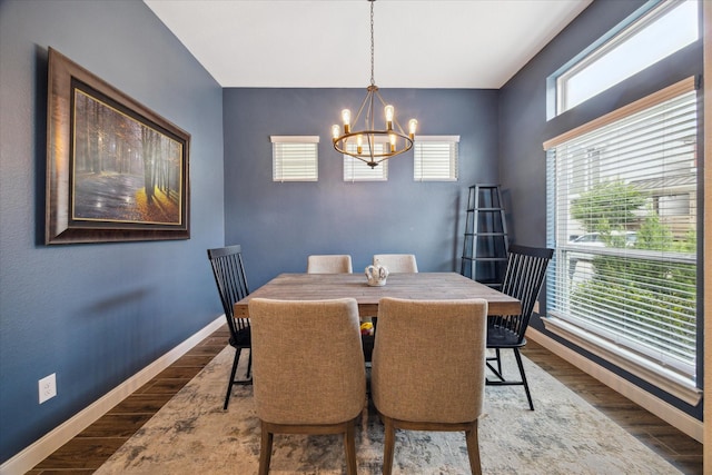 10407 Quiet Courtyard Rd, Houston, TX 77043 - dining area with a chandelier, baseboards, and wood finished floors