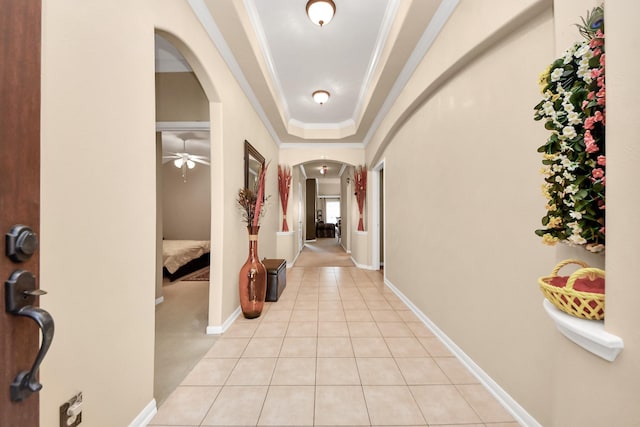 11126 E Lake Gables Dr, Richmond, TX 77406 - hall featuring arched walkways, light tile patterned floors, ornamental molding, and baseboards