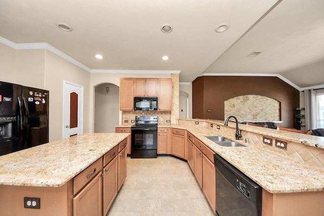 11126 E Lake Gables Dr, Richmond, TX 77406 - kitchen with a sink, black appliances, arched walkways, backsplash, and light stone counters