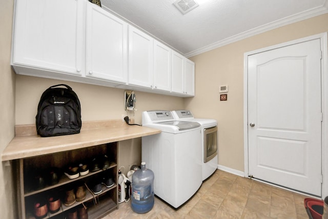 11126 E Lake Gables Dr, Richmond, TX 77406 - laundry area with cabinet space, independent washer and dryer, ornamental molding, and baseboards