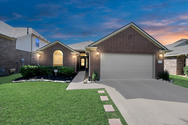 11126 E Lake Gables Dr, Richmond, TX 77406 - view of front of home featuring brick siding, a garage, a front lawn, and driveway