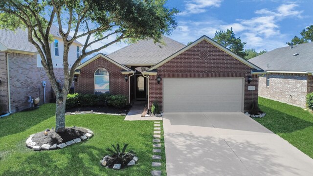 11126 E Lake Gables Dr, Richmond, TX 77406 - view of front of property with a garage, concrete driveway, brick siding, and a front yard