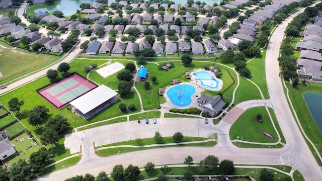 11126 E Lake Gables Dr, Richmond, TX 77406 - aerial view of property and surrounding area with a pool area, nearby suburban area, and a large body of water