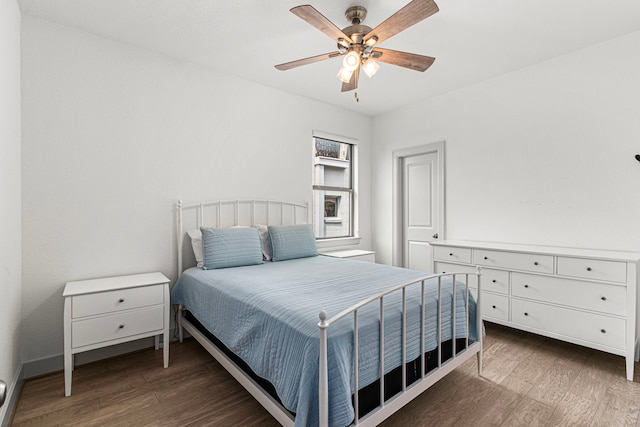 bedroom featuring wood finished floors and a ceiling fan