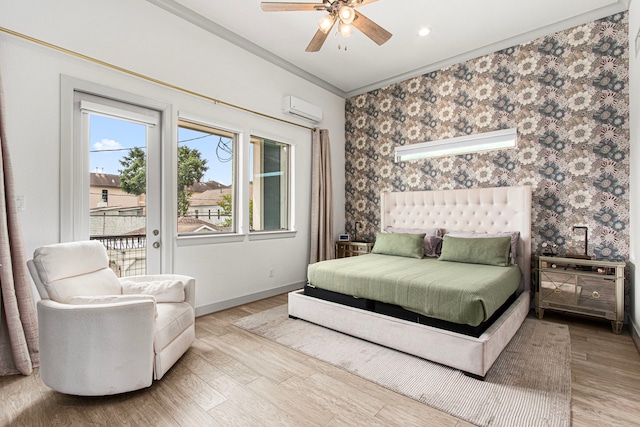 bedroom with access to outside, a wall mounted AC, ornamental molding, wood finished floors, and baseboards
