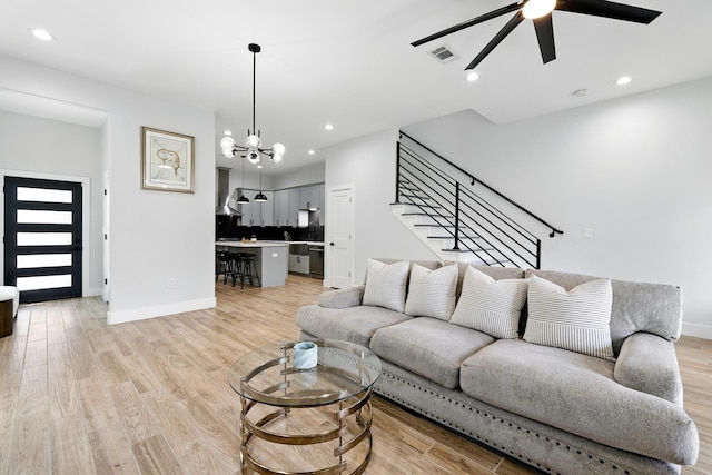 5209 Canal St, Houston, TX 77011 - living room with ceiling fan, light wood-style floors, a chandelier, baseboards, and recessed lighting