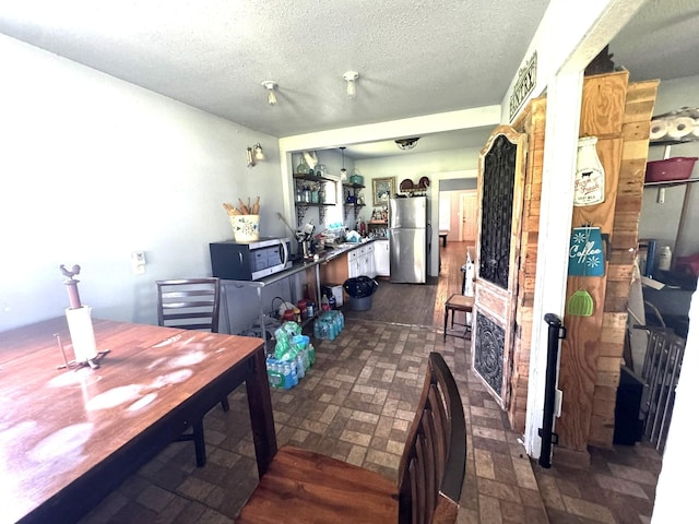 12215 Fm 442nd Rd, Boling, TX 77420 - dining space with a textured ceiling
