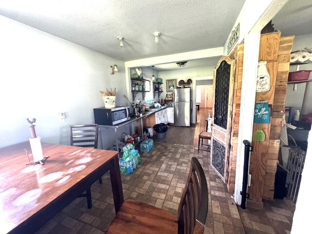 12215 Fm 442nd Rd, Boling, TX 77420 - dining room with a textured ceiling