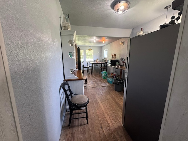 12215 Fm 442nd Rd, Boling, TX 77420 - hall featuring a textured wall and dark wood-style floors
