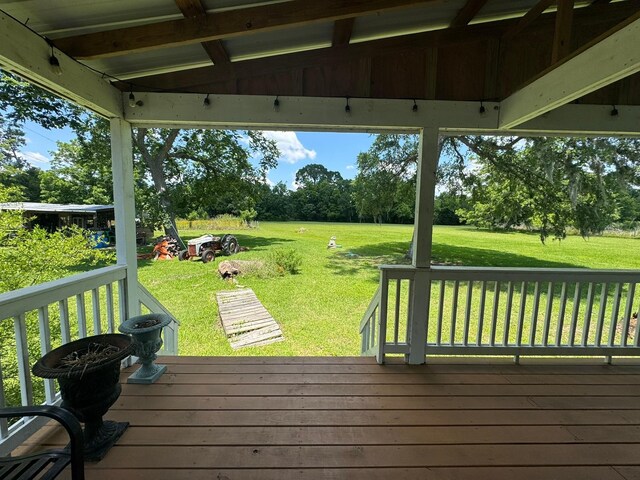 12215 Fm 442nd Rd, Boling, TX 77420 - deck with a lawn and view of wooded area
