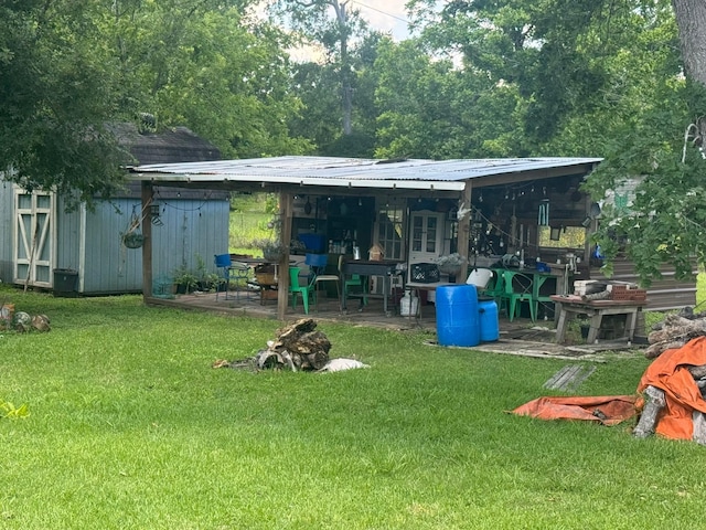 12215 Fm 442nd Rd, Boling, TX 77420 - view of grassy yard with an outbuilding and a patio area