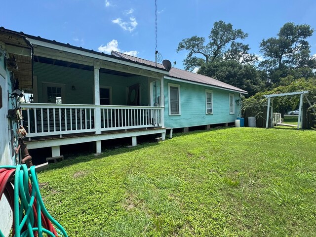12215 Fm 442nd Rd, Boling, TX 77420 - view of home's exterior with a lawn and metal roof