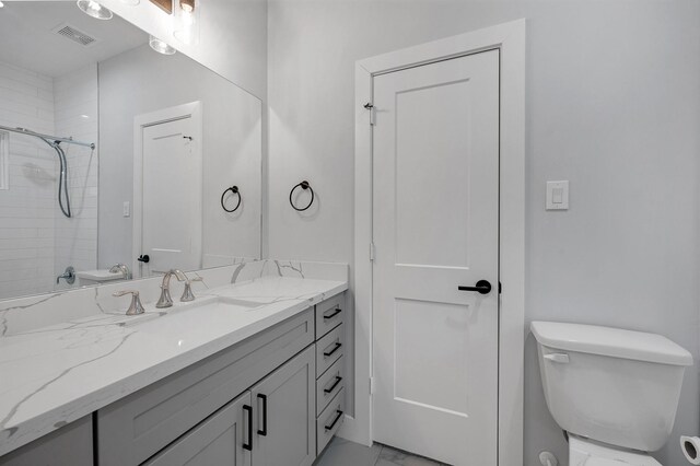 804 Woodcrest Dr Unit F, Houston, TX 77018 - bathroom featuring marble finish flooring, toilet, vanity, and a shower