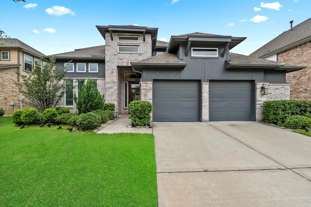 2824 Jehlon Ln, Conroe, TX 77385 - prairie-style home featuring a garage, concrete driveway, a front yard, roof with shingles, and stucco siding