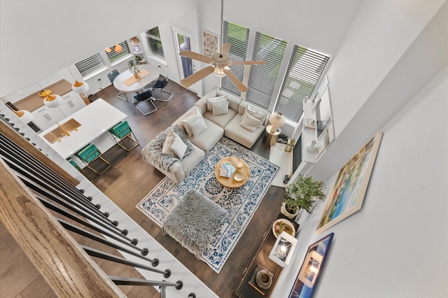 2824 Jehlon Ln, Conroe, TX 77385 - living room featuring a high ceiling, wood finished floors, and a ceiling fan