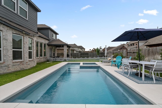 2824 Jehlon Ln, Conroe, TX 77385 - view of swimming pool with a patio, a fenced backyard, and a pool with connected hot tub
